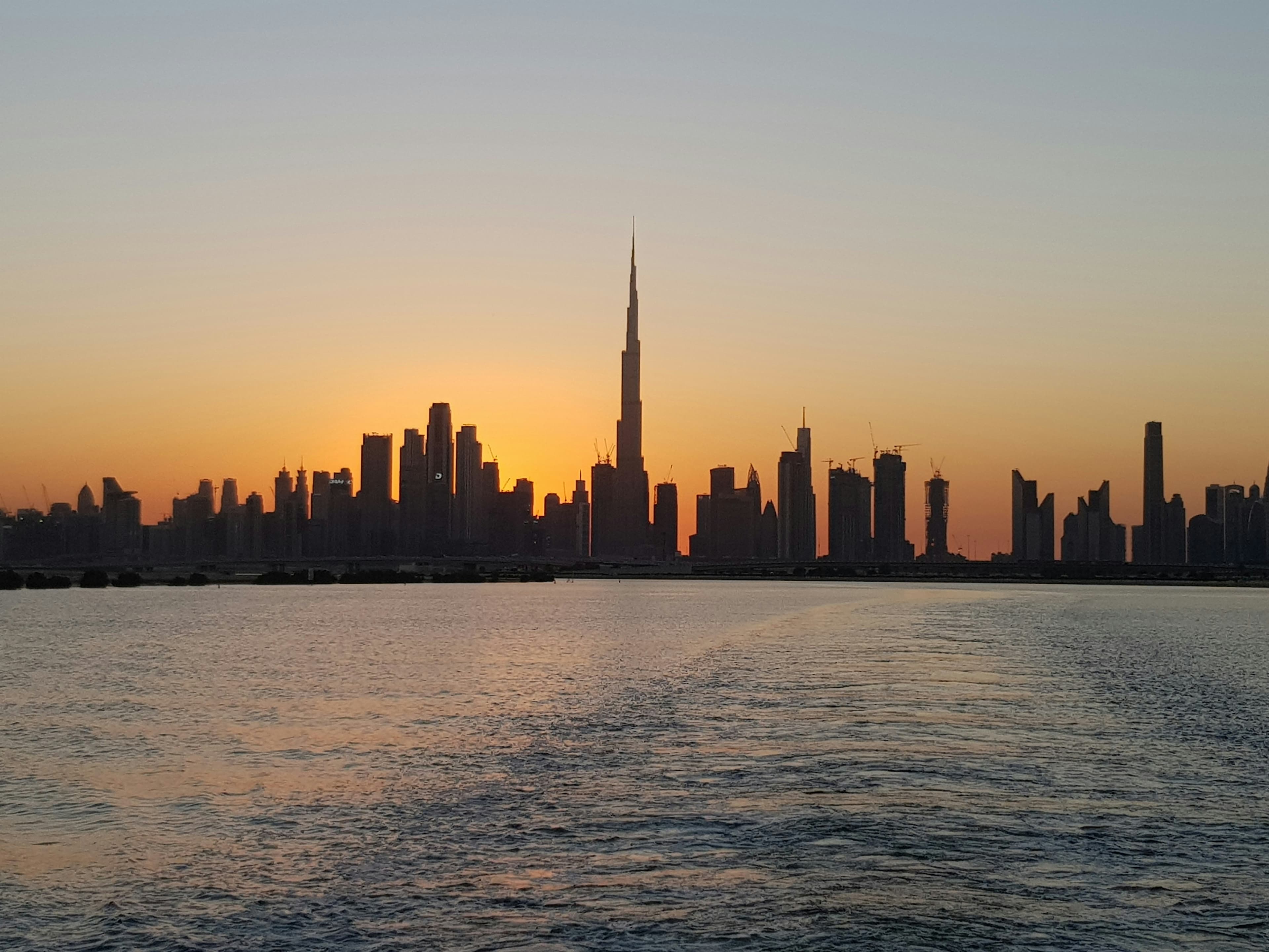 Dubai Sunset Waters & Burj Khalifa Silhouette